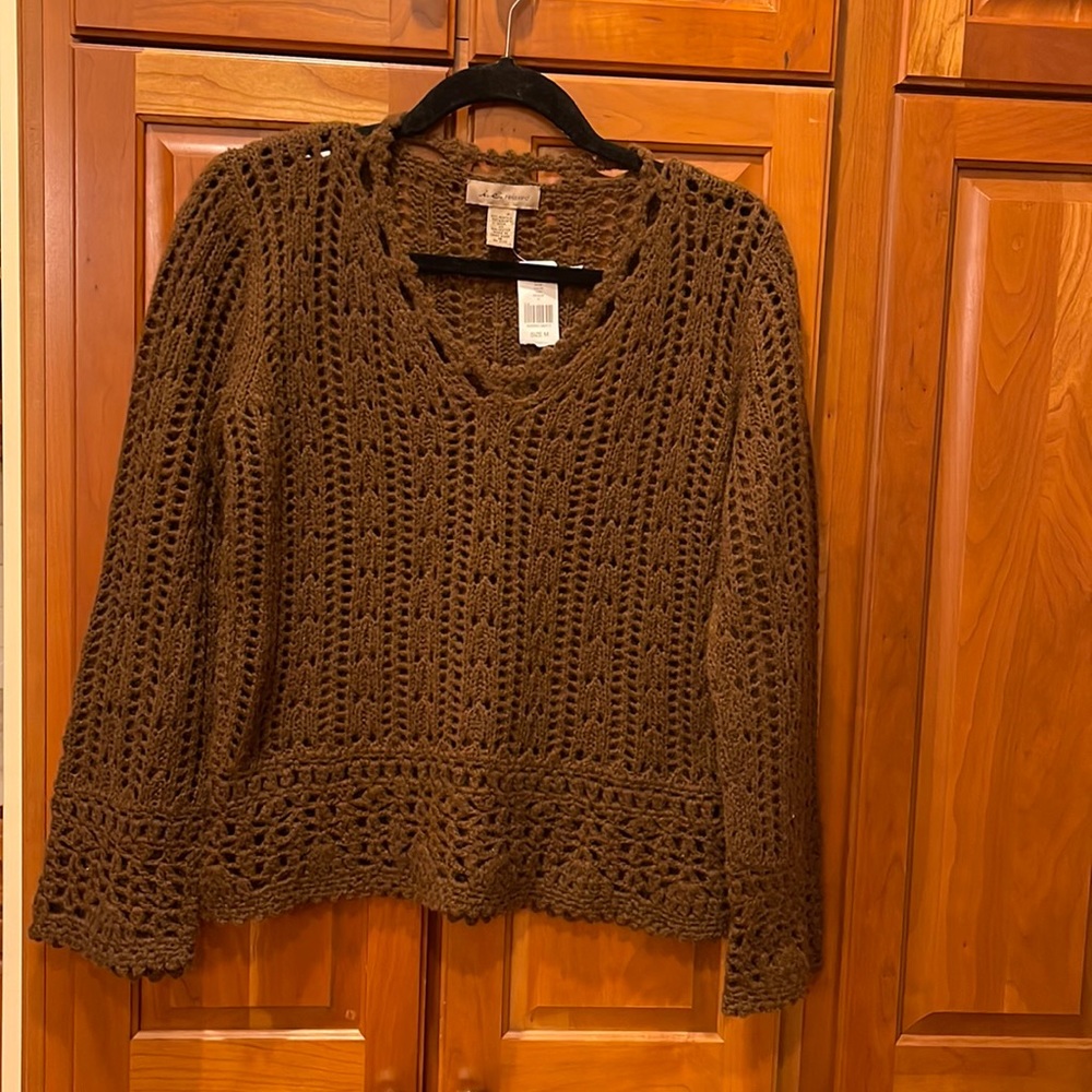 Loose knit v neck sweater.  New with tags.  Size medium.